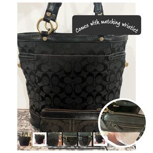 The Coach two-piece set includes a wristlet. USED.